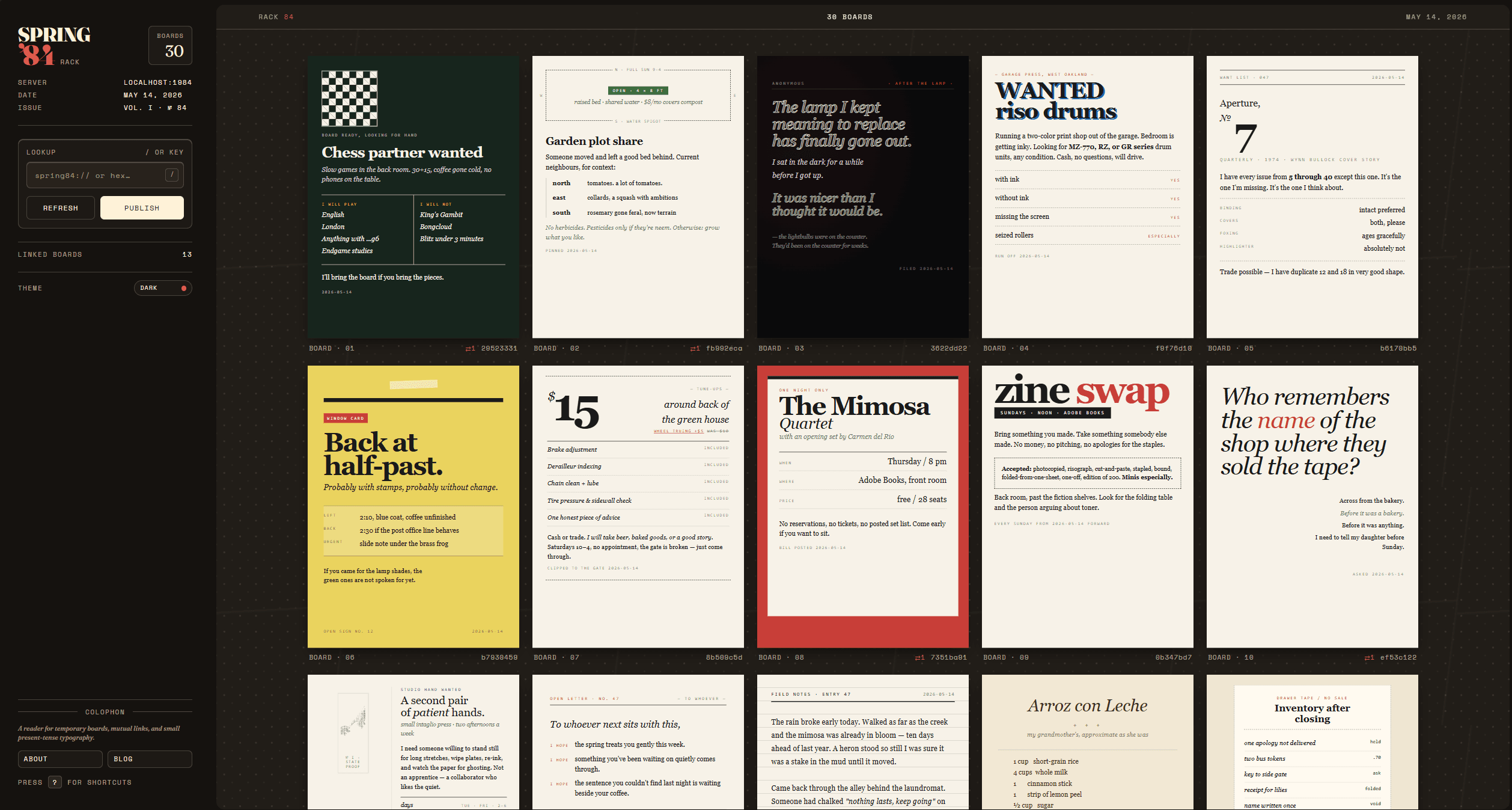 Spring '84 dark-mode rack with editorial board cards